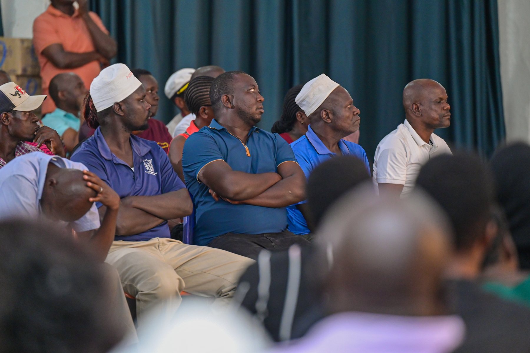 Audience members listening closely during the discussion