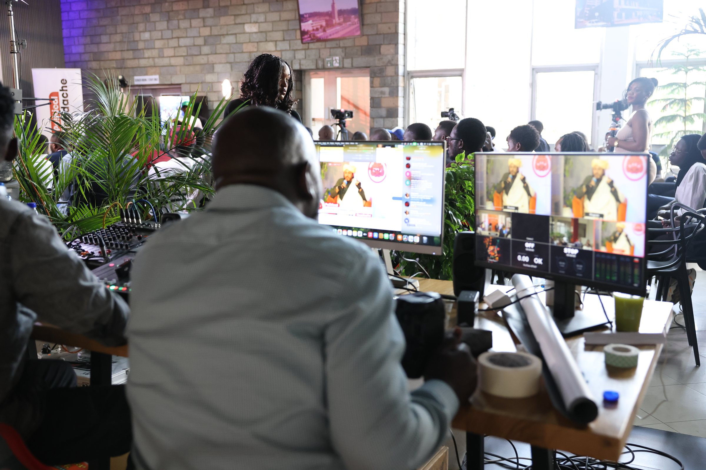 The production team monitoring the live event from multiple screens