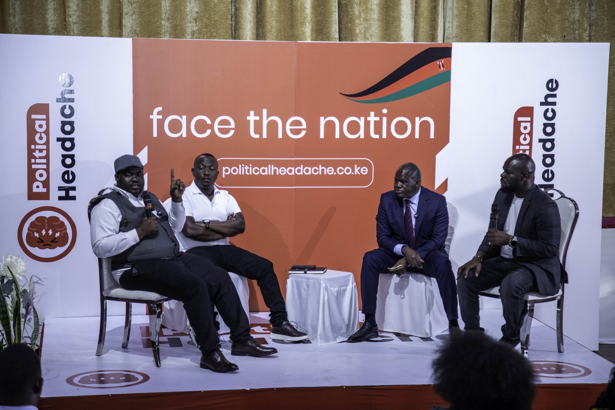 The full Face The Nation panel seated on stage