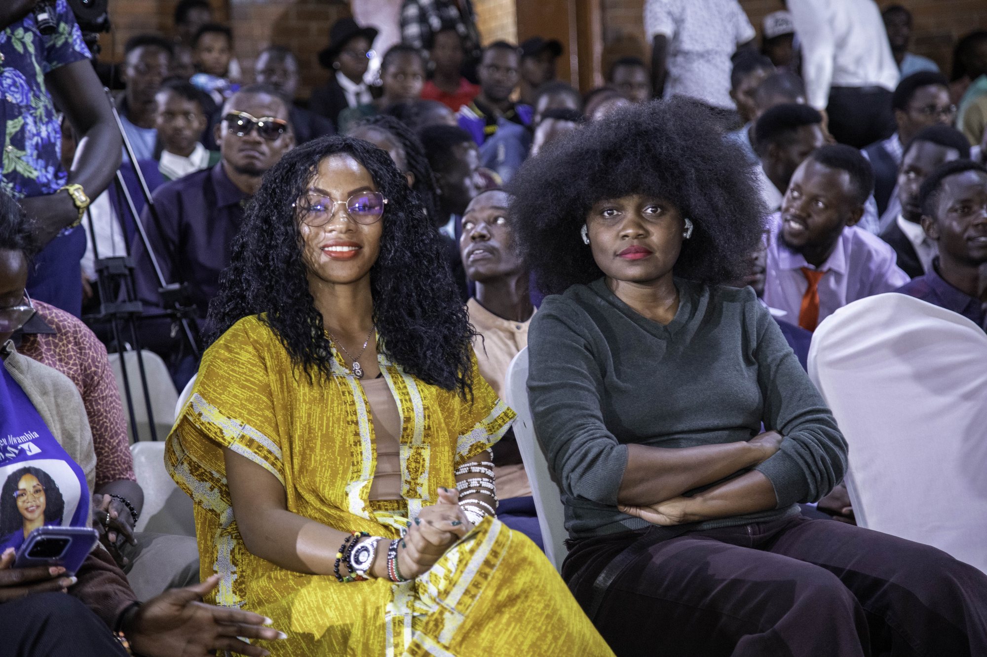 Two women seated together in the Nairobi audience